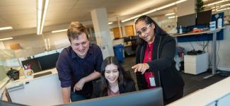 People working together around the computer